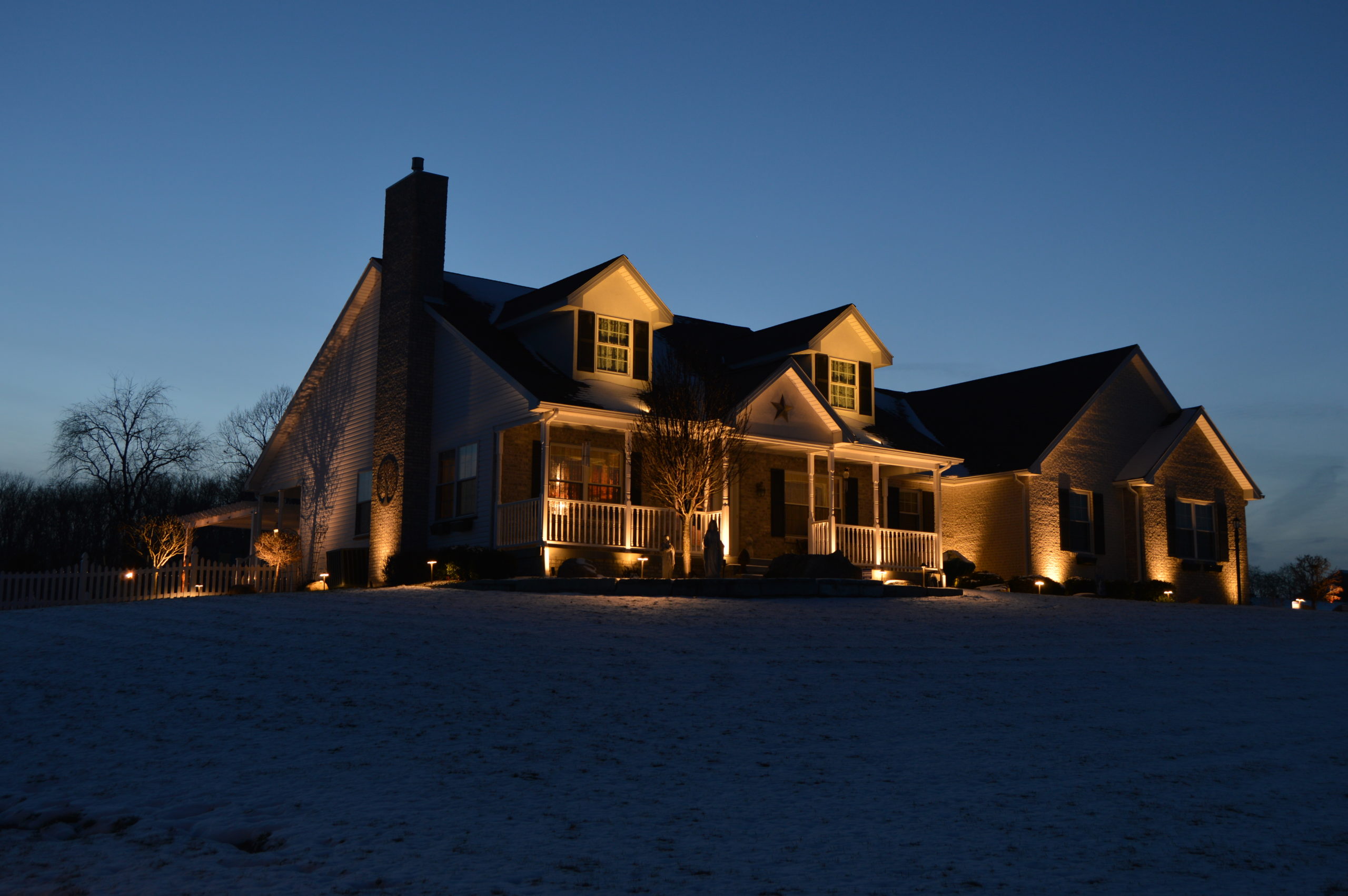 Illuminated house with hardscape and spotlighting