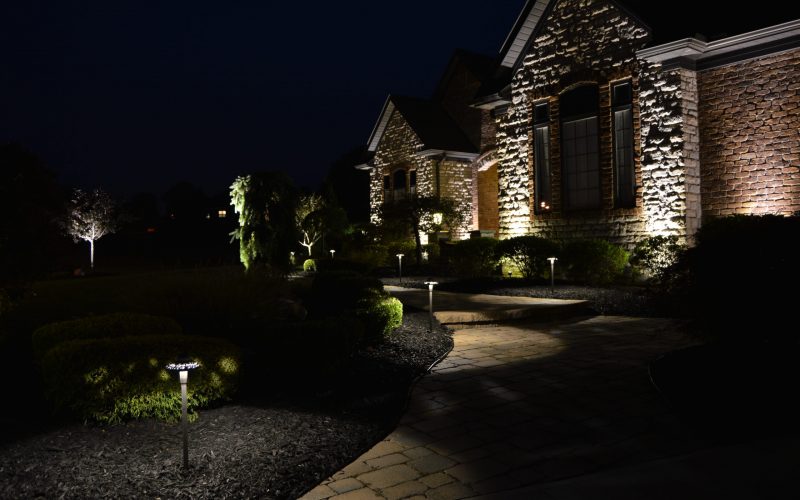 Illuminated front walkway of residential house