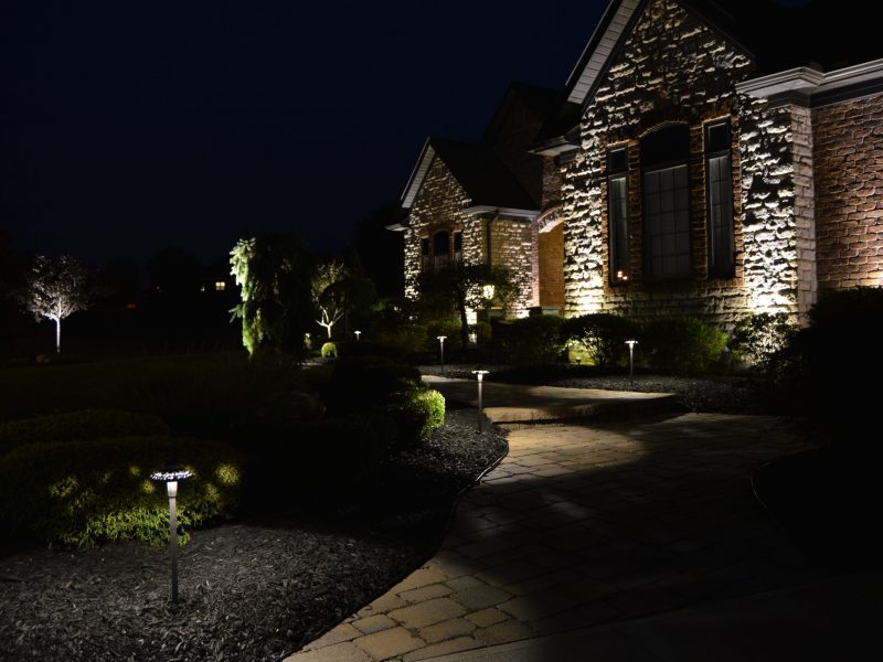 Illuminated front walkway of residential house