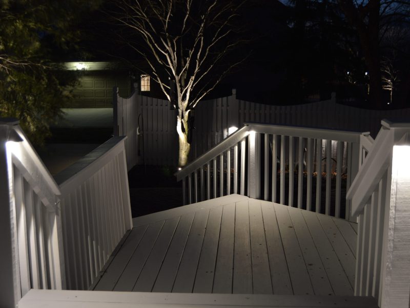 New white patio and deck with edison lighting