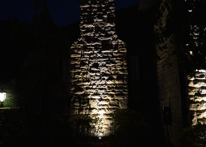 Front angle of Accent lighting on brick siding of house
