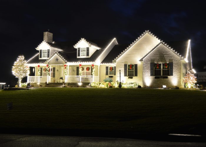 Home decorated with holiday lighting and holiday decorations
